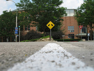 A road sign indicating a diverging roadway.
