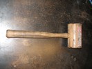 Photo of a wooden mallet.