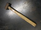Photo of a bronze mallet.