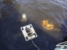 Four PVC pipe buoys are attached to this robot's frame.