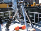 Sensor in tripod frame on dock.
