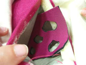 Top photo shows a piece of neoprene with holes cut in it, inserted inside the fabric pressure sensor sandwich; bottom photo shows the sensor placed at the bottom of the bag