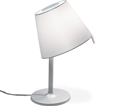 Table lamp with shade tilted to the side.