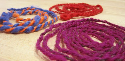 Photo of three coils of yarn.