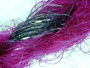 Set of four photos showing the steel fibers within the yarn.