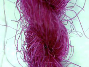 Set of four photos showing the steel fibers within the yarn.