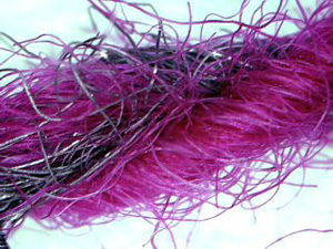 Set of four photos showing the steel fibers within the yarn.