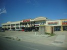 A strip mall with Vietnamese shops and restaurants.