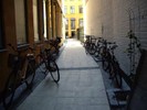 Bicycles racked in a Copenhagen alley.