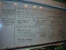 Whiteboard notes about observations of differences in bulbs at low voltage and high voltage.