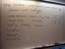 Whiteboard notes about linear diamter of blocking material.