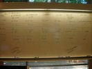Whiteboard notes about expanding universe table.