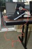 A high heeled boot has a pressure sensor and wires attached to it.