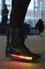 Boots with a strip of red lit up LEDs